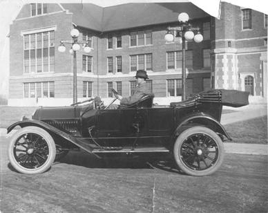 In this photo taken around 1915, Richardson sits in his automobile outside the Administration Building.