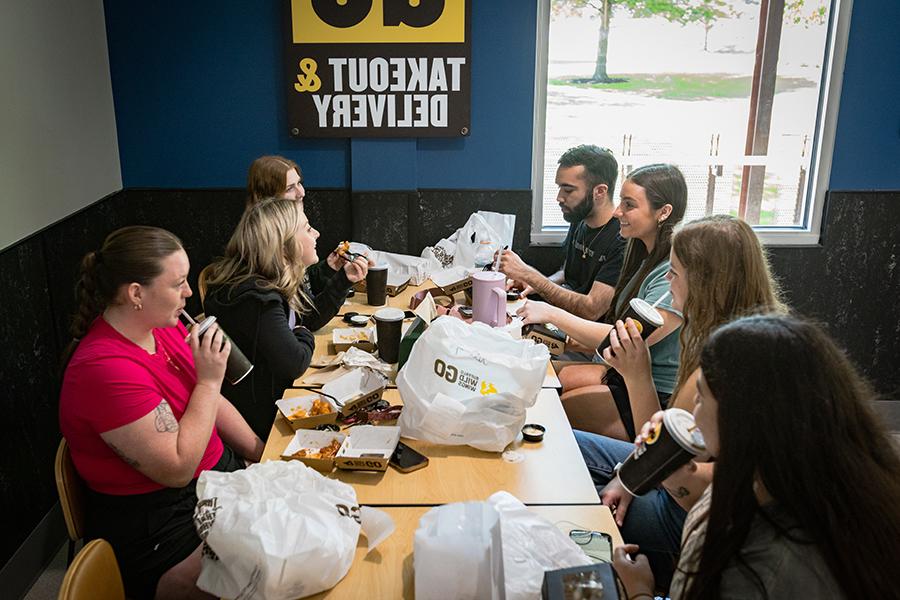 Northwest students enjoy a lunch at the campus's new Buffalo Wild Wings Go, which opened April 29, in The Station.